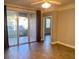 A light and airy living room with wood floors and sliding glass doors at 3468 Soho St # 107, Orlando, FL 32835