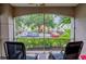 Screened-in patio with seating, perfect for relaxation and outdoor enjoyment at 3468 Soho St # 107, Orlando, FL 32835