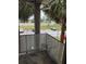 Private balcony overlooking the parking lot and green space at 6008 Village Cir # Ge, Orlando, FL 32822