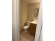 Small bathroom with wood vanity and tiled floor at 6008 Village Cir # Ge, Orlando, FL 32822