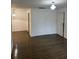 Open living room with wood-look floors and ample natural light at 6008 Village Cir # Ge, Orlando, FL 32822