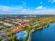 Aerial view of community with pool and lake at 8547 Leatherleaf Ln, Orlando, FL 32827