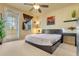 Spacious bedroom with king-size bed and private balcony at 8547 Leatherleaf Ln, Orlando, FL 32827