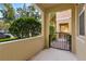 Covered patio with wrought iron gate and access to community at 8547 Leatherleaf Ln, Orlando, FL 32827