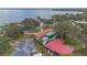 An aerial view of a neighborhood showcasing homes and a lake in the background at 1407 Edgewater Beach Dr, Lakeland, FL 33805