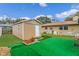 Spacious backyard with storage shed, green turf, and partial fencing, perfect for outdoor activities at 1407 Edgewater Beach Dr, Lakeland, FL 33805