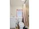 Compact bathroom with a shower and tub combo, a simple vanity, and neutral decor at 1407 Edgewater Beach Dr, Lakeland, FL 33805