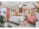 This stylish bedroom offers soft natural lighting and a decorative color scheme creating a warm retreat at 1407 Edgewater Beach Dr, Lakeland, FL 33805