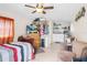 Studio bedroom featuring bed, dresser, storage, kitchenette, and lounge area for relaxed living at 1407 Edgewater Beach Dr, Lakeland, FL 33805
