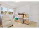 Bright bedroom featuring natural light and ample space ready for personalization with boxes and decor at 1407 Edgewater Beach Dr, Lakeland, FL 33805