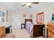 This simple bedroom has a ceiling fan for comfort, a window for natural light, and a relaxing atmosphere at 1407 Edgewater Beach Dr, Lakeland, FL 33805