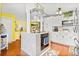 Well-appointed kitchen with stainless steel appliances, a functional island, and hardwood floors at 1407 Edgewater Beach Dr, Lakeland, FL 33805