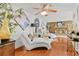 Cozy living room with hardwood floors, brick fireplace and curated decor at 1407 Edgewater Beach Dr, Lakeland, FL 33805