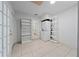 Laundry room with washer, dryer, shelving, and tile floors at 357 Lariat Ln, Kissimmee, FL 34743