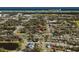 Panoramic aerial view of the neighborhood showcasing lush greenery, nearby parks, and proximity to the ocean at 841 Vernon St, Daytona Beach, FL 32114