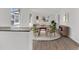 Bright living room with lots of light, wood floors, dining area, and neutral paint at 841 Vernon St, Daytona Beach, FL 32114