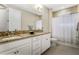 Bathroom with granite countertop and double vanity at 13219 Woodford St, Orlando, FL 32832