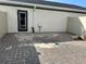 Unlandscaped backyard with paver patio at 1344 Lumpini St, Saint Cloud, FL 34771