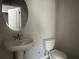 Simple bathroom with pedestal sink and toilet at 1344 Lumpini St, Saint Cloud, FL 34771