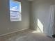 Sunlit bedroom with a view, featuring light walls and a window for natural light at 1344 Lumpini St, Saint Cloud, FL 34771