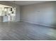 Open dining area with gray walls and wood-look tile flooring at 1344 Lumpini St, Saint Cloud, FL 34771