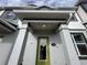 Inviting entrance with a green door, gray trim, and the house number 1344 at 1344 Lumpini St, Saint Cloud, FL 34771