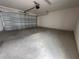 Spacious and empty new two car garage with smooth concrete flooring at 1344 Lumpini St, Saint Cloud, FL 34771