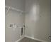 Laundry room with shelving and built-in dog door at 1344 Lumpini St, Saint Cloud, FL 34771