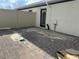 Back patio featuring a brick paved surface, providing an outdoor living area at 1344 Lumpini St, Saint Cloud, FL 34771