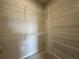 Walk-in closet with multiple shelves and hanging racks for optimal organization at 1344 Lumpini St, Saint Cloud, FL 34771