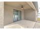 Covered patio with sliding glass doors and ceiling fan at 171 Pheasant Dr, Haines City, FL 33844
