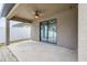 Covered back patio with sliding glass doors and ceiling fan at 171 Pheasant Dr, Haines City, FL 33844