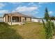 Landscaped backyard with pergola and fire pit at 171 Pheasant Dr, Haines City, FL 33844