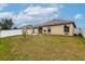 Spacious backyard with pergola, fire pit, and fenced enclosure at 171 Pheasant Dr, Haines City, FL 33844