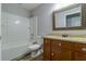 Bathroom with tub, toilet, and vanity with granite top at 171 Pheasant Dr, Haines City, FL 33844