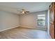 Spacious bedroom featuring a ceiling fan and barn door at 171 Pheasant Dr, Haines City, FL 33844