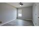Bright bedroom with wood-look floors and ceiling fan at 171 Pheasant Dr, Haines City, FL 33844