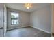 Simple bedroom with wood-look floors and ceiling fan at 171 Pheasant Dr, Haines City, FL 33844