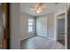 Bright bedroom with ceiling fan, window, and double doors at 171 Pheasant Dr, Haines City, FL 33844