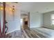 Bright and spacious entryway with wood-look floors and an open floor plan at 171 Pheasant Dr, Haines City, FL 33844