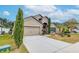 Two-story house with attached garage and nicely landscaped front yard at 171 Pheasant Dr, Haines City, FL 33844