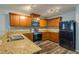 Modern kitchen with stainless steel appliances and granite countertops at 171 Pheasant Dr, Haines City, FL 33844