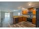 Open kitchen features granite counters and stainless steel appliances at 171 Pheasant Dr, Haines City, FL 33844