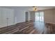 Living room with wood-look floors and access to patio at 171 Pheasant Dr, Haines City, FL 33844