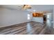 Bright living room with wood-look floors and kitchen view at 171 Pheasant Dr, Haines City, FL 33844