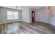 Spacious living room with wood-look floors and neutral wall colors at 171 Pheasant Dr, Haines City, FL 33844