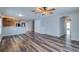 Open living area with wood-look floors and ceiling fan at 171 Pheasant Dr, Haines City, FL 33844
