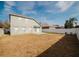 Large fenced backyard with a well maintained lawn and an outdoor patio area at 2142 Brandywine Falls Way, Orlando, FL 32824