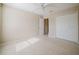 Bedroom features neutral carpet and walls with a large double-door closet at 2142 Brandywine Falls Way, Orlando, FL 32824
