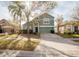 Two-story home with a well maintained lawn and a two car garage at 2142 Brandywine Falls Way, Orlando, FL 32824